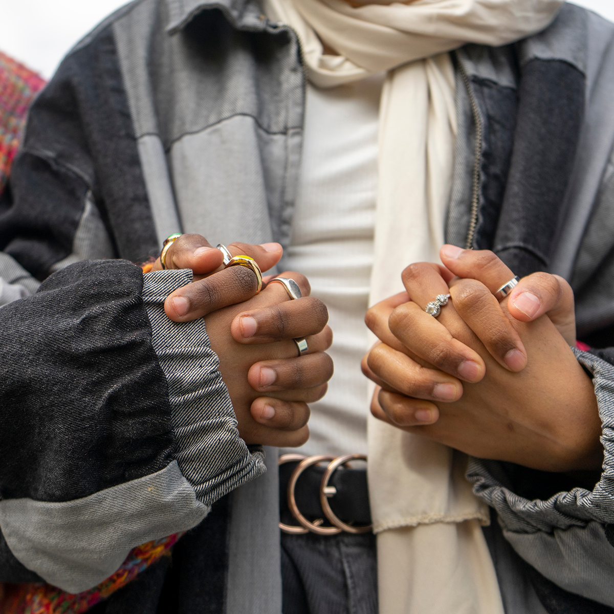 close up of women holding hands in support