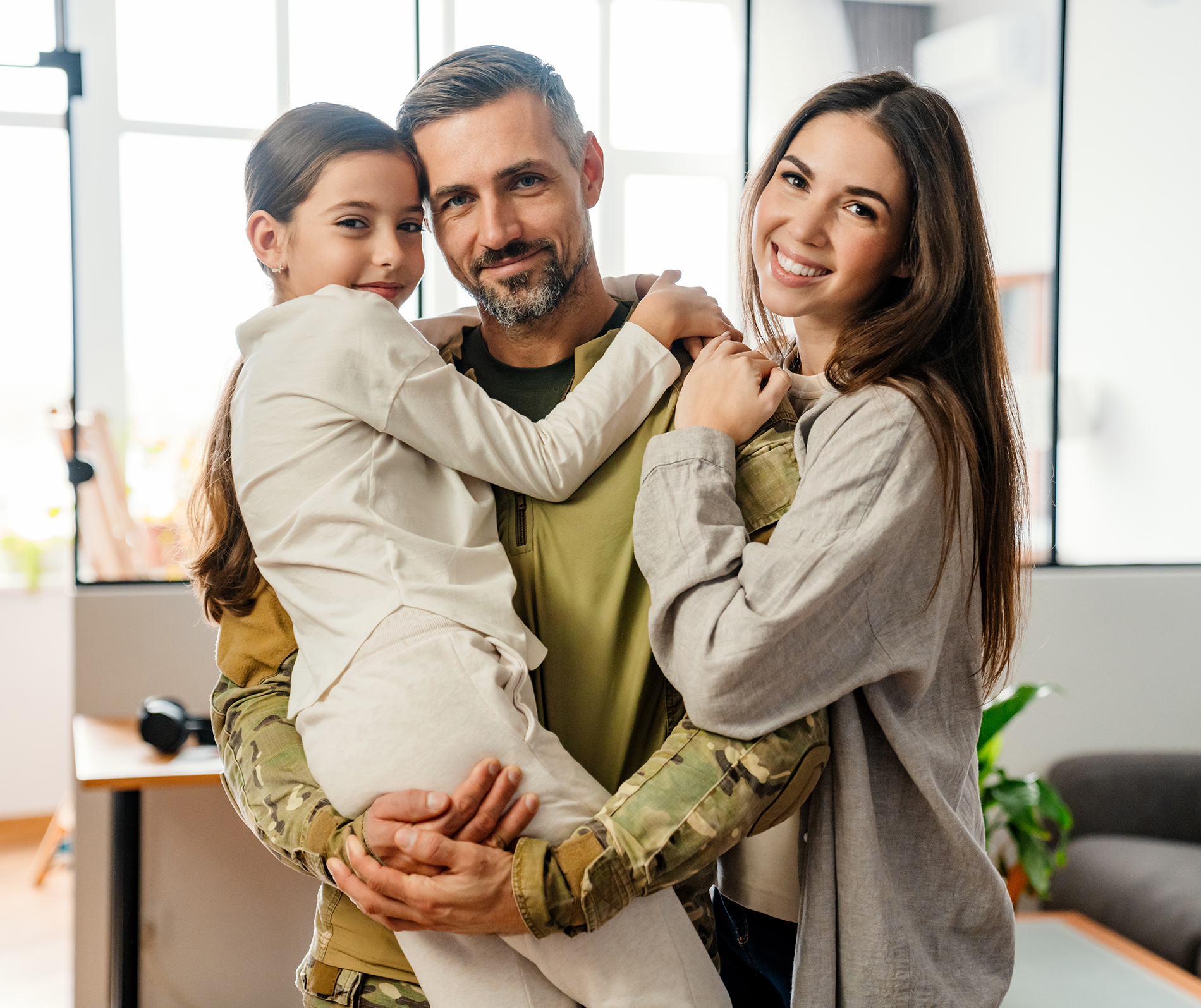 family of three smiling together