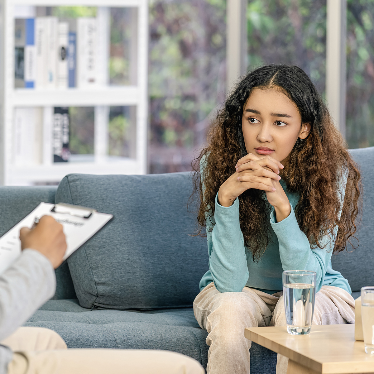 Teen girl talking with therapist